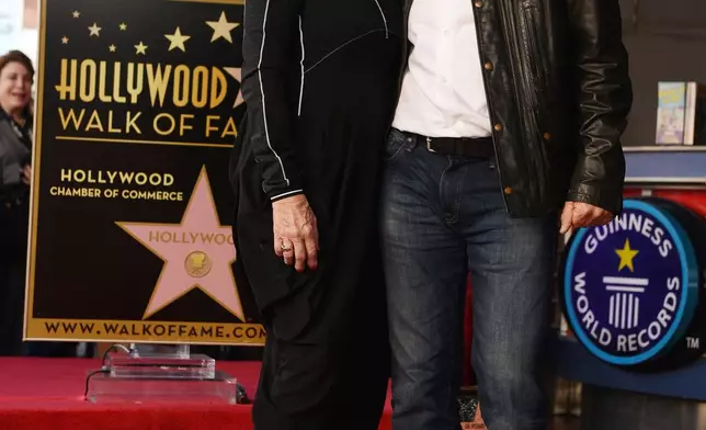 FILE - British business magnate Richard Branson, right, appears with his wife Joan Templeman Branson during a ceremony honoring him with a star on the Hollywood Walk of Fame, in Los Angeles, Oct. 16, 2018. (Photo by Chris Pizzello/Invision/AP, File)