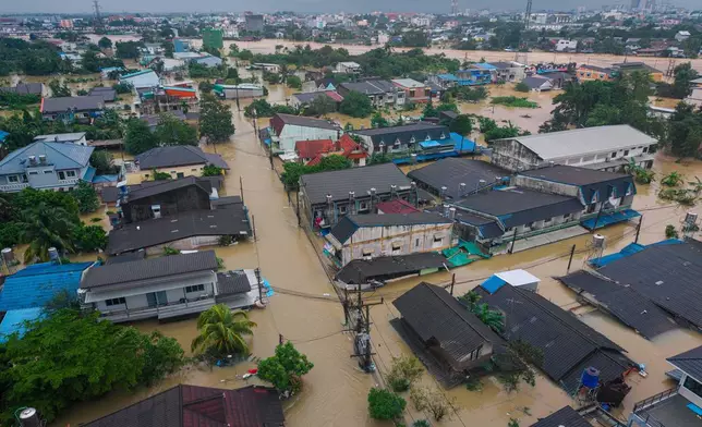 Houses are submerged by floods in Songkhla province, southern Thailand, Wednesday, Nov. 26, 2025. (AP Photo/Arnun Chonmahatrakool)