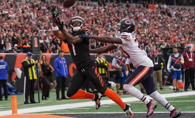 Cincinnati Bengals wide receiver Ja'Marr Chase (1) tries to catch a pass under pressure from Chicago Bears cornerback Tyrique Stevenson (29) during the first half of an NFL football game, Sunday, Nov. 2, 2025, in Cincinnati. (AP Photo/Joshua A. Bickel)