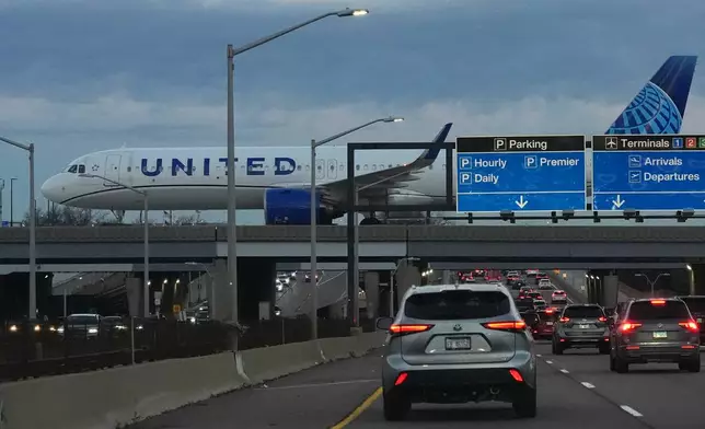 An United Airlines flight arrives at O'Hare International Airport in Chicago, Monday, Nov. 3, 2025. (AP Photo/Nam Y. Huh)