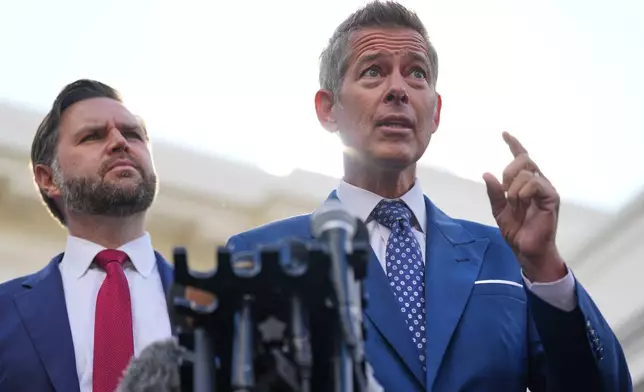 Transportation Secretary Sean Duffy speaks alongside Vice President JD Vance about the impact of the government shutdown on the aviation industry, outside of the West Wing of the White House, Thursday, Oct. 30, 2025, in Washington. (AP Photo/Jacquelyn Martin)