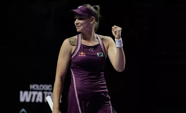 Elena Rybakina of Kazakhstan celebrates after defeating Aryna Sabalenka of Belarus in the women's final singles match of the WTA finals in Riyadh, Saudi Arabia, Saturday, Nov. 8, 2025. (AP Photo/ Fatima Shbair)