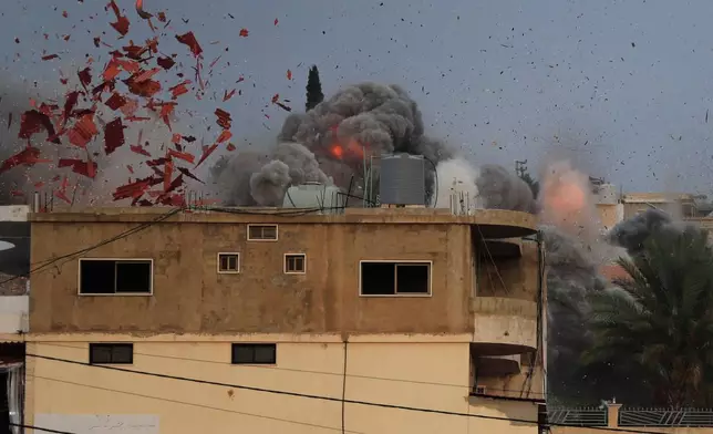 Smoke rises following an Israeli airstrike in the village of Teir Debba, southern Lebanon, Thursday, Nov. 6, 2025. (AP Photo/Mohammad Zaatari)