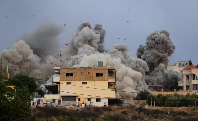 Smoke rises following an Israeli airstrike in the village of Teir Debba, southern Lebanon, Thursday, Nov. 6, 2025. (AP Photo/Mohammad Zaatari)