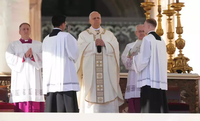 Pope Leo XIV presides over Mass with participants in the Jubilee of the Educational World on the Solemnity of All Saints, in St. Peter's Square, at the Vatican, Saturday, Nov. 1, 2025, during which he will proclaim St. John Henry Newman a Doctor of the Church. (AP Photo/Andrew Medichini)