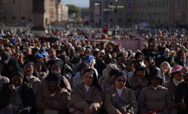 Nuns attend a Mass with Pope Leo XIV and the Jubilee of the Educational World on the Solemnity of All Saints, in St. Peter's Square, at the Vatican, Saturday, Nov. 1, 2025, during which he will proclaim St. John Henry Newman a Doctor of the Church. (AP Photo/Andrew Medichini)