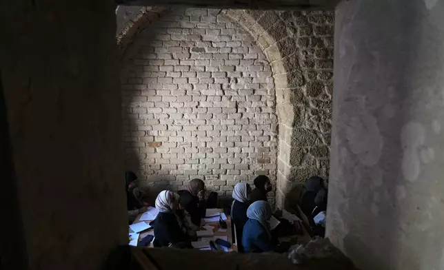 Palestinian high school students return to class weeks after a ceasefire was announced between Israel and Hamas, at the Kamilia School in the Old City of Gaza City, Wednesday, Nov. 12, 2025. (AP Photo/Jehand Alshrafi)