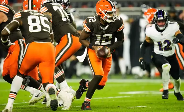 Cleveland Browns quarterback Shedeur Sanders (12) drops back from the line of srimmage during the second half of an NFL football game against the Baltimore Ravens in Cleveland, Sunday, Nov. 16, 2025. (AP Photo/Sue Ogrocki)