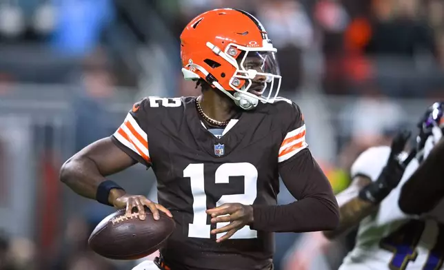 Cleveland Browns quarterback Shedeur Sanders (12) drops back to pass in the second half of an NFL football game against the Baltimore Ravens in Cleveland, Sunday, Nov. 16, 2025. (AP Photo/David Richard)