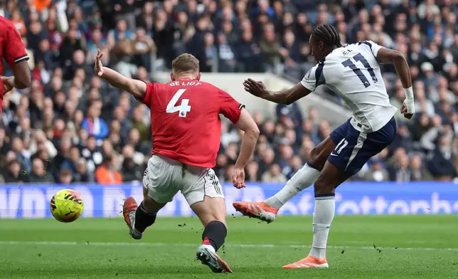 Tottenham's Mathys Tel, right, scores his side's second goal past Manchester United's Matthijs de Ligt during the English Premier League soccer match between Tottenham Hotspur and Manchester United in London, England, Saturday, Nov. 8, 2025. (AP Photo/Ian Walton)