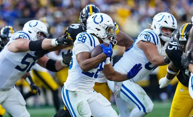 Indianapolis Colts running back Jonathan Taylor (28) runs against the Pittsburgh Steelers during the second half of an NFL football game in Pittsburgh, Sunday, Nov. 2, 2025. (AP Photo/Matt Freed)