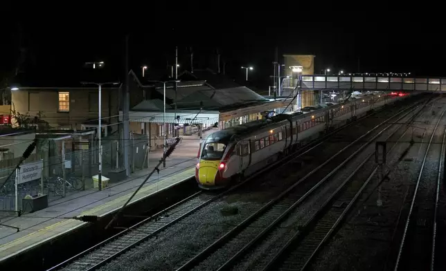 The Huntingdon, England, train station in Cambridgeshire is seen after people were stabbed on a train, Saturday, Nov. 1, 2025. (Chris Radburn/PA via AP)