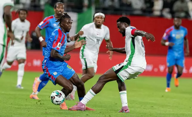 Congo's Ngal'ayel Mukau challenges Nigeria's Wilfred Ndidi during the World Cup African qualifier soccer match between Congo and Nigeria, in Rabat, Morocco, Sunday, Nov. 16, 2025. (AP Photo)