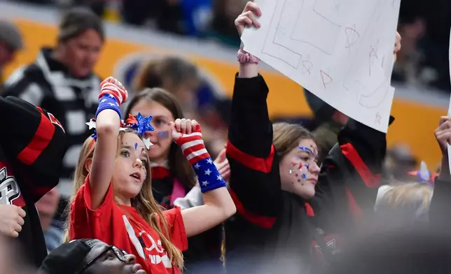 United States fans celebrate a goal during the second period of a Rivalry Series women's hockey game against Canada, Saturday, Nov. 8, 2025, in Buffalo, N.Y. (AP Photo/Adrian Kraus)