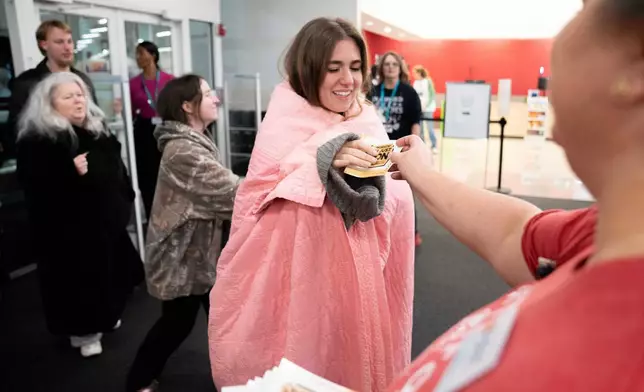 Shoppers enter a Kohl's department store for Black Friday to shop for deals, Friday, Nov. 28, 2025, in Woodstock, Ga. (AP Photo/Megan Varner)
