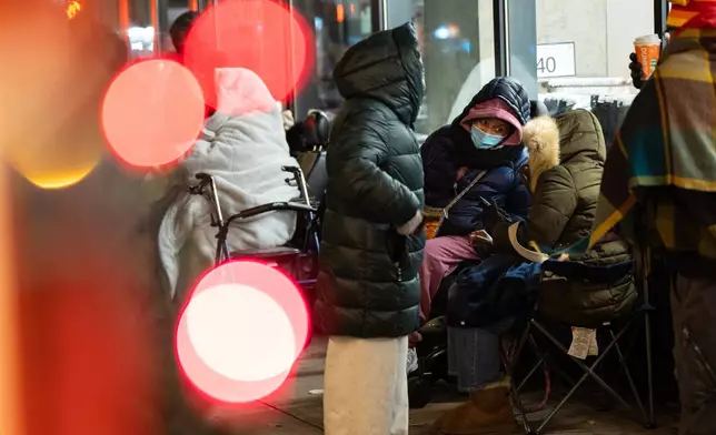 Black Friday Shoppers wait in line to enter Target on Friday, Nov. 28, 2025 in New York. (AP Photo/Angelina Katsanis)