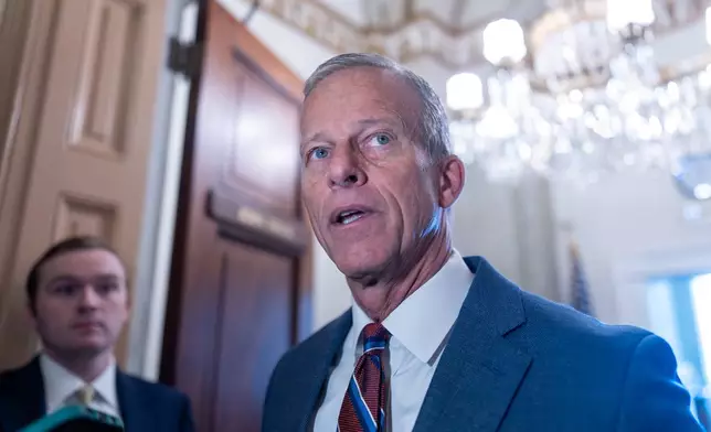 Senate Majority Leader John Thune, R-S.D., speaks to reporters as he arrives at his office following a weekend vote to move forward with a stopgap funding bill to reopen the government through Jan. 30, at the Capitol in Washington, Monday, Nov. 10, 2025. (AP Photo/J. Scott Applewhite)