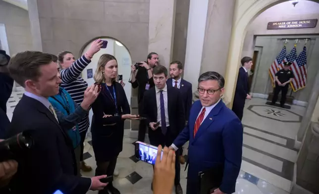 Speaker of the House Mike Johnson, R-La., talks with reporters outside his office at the U.S. Capitol, Wednesday, Nov. 12, 2025, in Washington. (AP Photo/Rod Lamkey, Jr.)