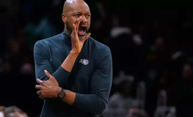 Orlando Magic head coach Jamahl Mosley calls to his players during the first half of an NBA basketball game against the Boston Celtics, Sunday, Nov. 23, 2025, in Boston. (AP Photo/Charles Krupa)