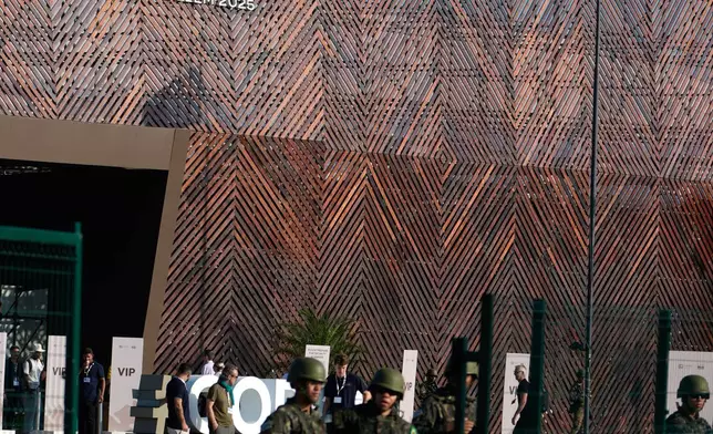 Security personnel work outside the venue for the COP30 U.N. Climate Summit, Monday, Nov. 17, 2025, in Belem, Brazil. (AP Photo/Fernando Llano)