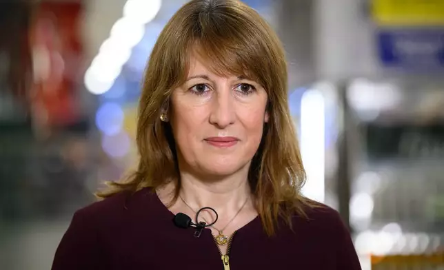 British Chancellor of the Exchequer Rachel Reeves speaks to the media during a visit to a branch of the Tesco supermarket chain in London, Wednesday Nov. 19, 2025 in. (Leon Neal/Pool Photo via AP)