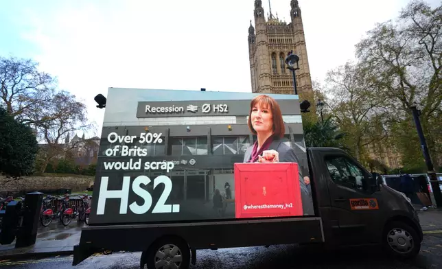 A van displays an electronic screen showing Britain's Chancellor Rachel Reeves ahead of Wednesday's Autumn Budget, in London, Monday, Nov. 24, 2025. (AP Photo/Kirsty Wigglesworth)