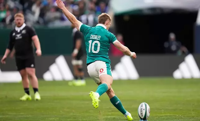 Ireland's Jack Crowley kicks a penalty goal during the rugby international between the All Blacks and Ireland in Chicago, Saturday, Nov. 1, 2025. (AP Photo/Erin Hooley)