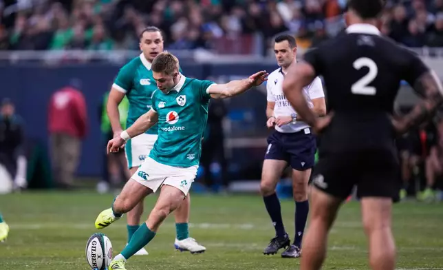 Ireland's Jack Crowley kicks a penalty goal during the rugby international between the All Blacks and Ireland in Chicago, Saturday, Nov. 1, 2025. (AP Photo/Erin Hooley)