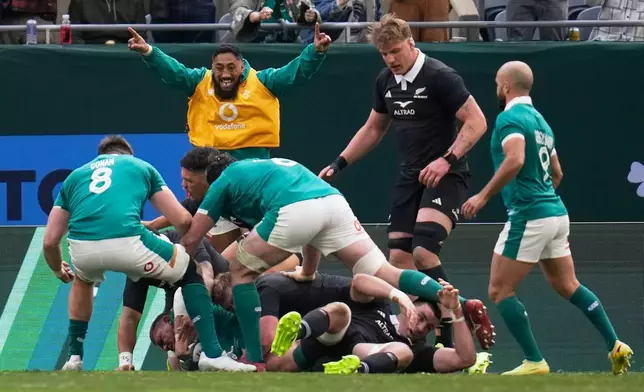 Ireland players react after scoring their first try during the rugby international between the All Blacks and Ireland in Chicago, Saturday, Nov. 1, 2025. (AP Photo/Erin Hooley)