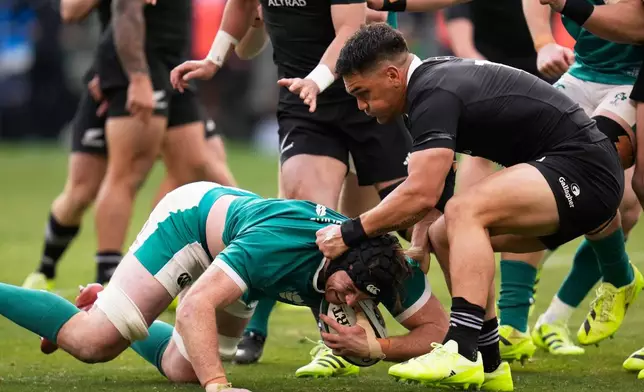 New Zealand's Quinn Tupaea, right, tackles Ireland's Ryan Baird during the rugby international between the All Blacks and Ireland in Chicago, Saturday, Nov. 1, 2025. (AP Photo/Erin Hooley)