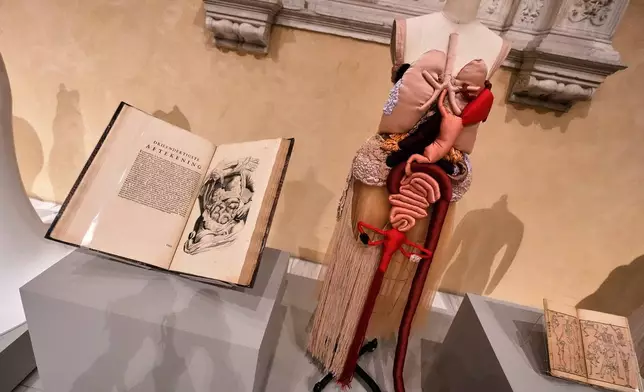 "Corset Anatomia" by Renata Buzzo, right, is displayed during the announcement, at the Metropolitan Museum of Art, in New York, Monday, Nov. 17, 2025, about the next spring fashion exhibit "Costume Art," which is set to launch at the Met Gala in 2026. (AP Photo/Richard Drew)