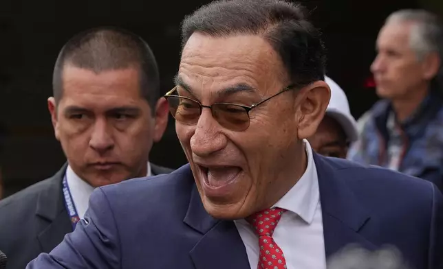 Former President Martin Vizcarra, who faces corruption charges, arrives for a sentence hearing in Lima, Peru, Wednesday, Nov. 26, 2025. (AP Photo/Guadalupe Pardo)