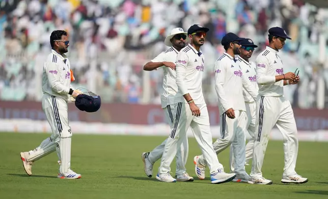 Indian players walk off the field for lunch on the first day of the first cricket test match between India and South Africa in Kolkata, India, Friday, Nov. 14, 2025. (AP Photo/Aijaz Rahi)