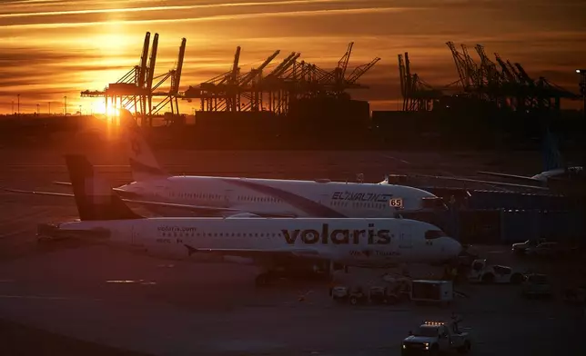 Planes are seen at Newark Liberty International Airport on Friday, Nov. 7, 2025, in Newark, N.J. (AP Photo/Andres Kudacki)
