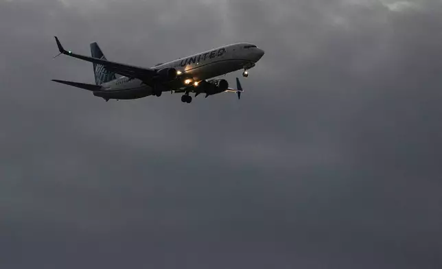 An United Airlines flight arrives at O'Hare International Airport in Chicago, Monday, Nov. 3, 2025. (AP Photo/Nam Y. Huh)