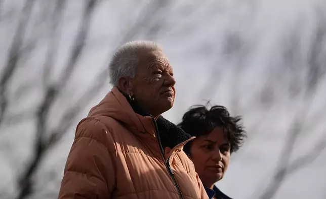 Fran Cooper, left, accompanied by her care giver Lily Bubjaku, waits in line durning an emergency food distribution at The Jewish Federation of Greater Philadelphia's Mitzvah Food Program in Philadelphia, Friday, Nov. 7, 2025. (AP Photo/Matt Rourke)