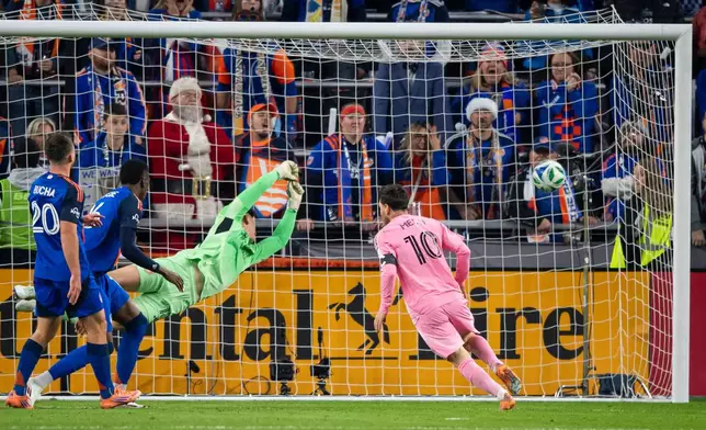 Inter Miami forward Lionel Messi (10) scores as FC Cincinnati goalkeeper Roman Celentano, third from left, tries to defend during the first half of MLS soccer's Eastern Conference semifinal Sunday, Nov. 23, 2025, in Cincinnati. (AP Photo/Tanner Pearson)