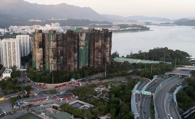 An aerial view of the burnt buildings after a deadly fire that started Wednesday at Wang Fuk Court, a residential estate in the Tai Po district of Hong Kong's New Territories, Friday, Nov. 28, 2025. (AP Photo/Ng Han Guan)