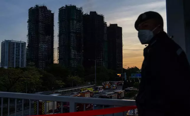 Burned buildings are seen at the scene of the fire at Wang Fuk Court, a residential estate in the Tai Po district of Hong Kong's New Territories, Friday, Nov. 28 2025. (AP Photo/Chan Long Hei)