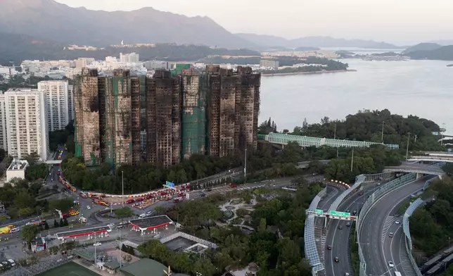 An aerial view of the burnt buildings after a deadly fire that started Wednesday at Wang Fuk Court, a residential estate in the Tai Po district of Hong Kong's New Territories, Friday, Nov. 28, 2025. (AP Photo/Ng Han Guan)