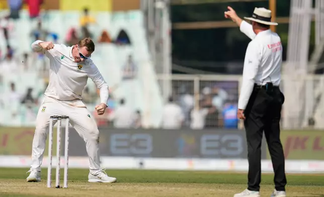 South Africa's Simon Harmer celebrates the dismissal of India's Ravindra Jadeja on the second day of the first cricket test match between India and South Africa in Kolkata, India, Saturday, Nov. 15, 2025. (AP Photo/Aijaz Rahi)