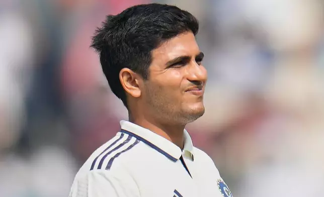 India's captain Shubman Gill reacts as he leaves the field after retired hurt on the second day of the first cricket test match between India and South Africa in Kolkata, India, Saturday, Nov. 15, 2025. (AP Photo/Aijaz Rahi)