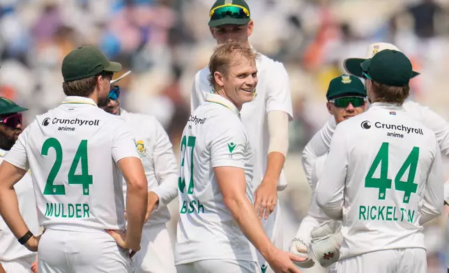 South Africa's Corbin Bosch, center, celebrates with teammates after the dismissal of India's Rishabh Pant on the second day of the first cricket test match between India and South Africa in Kolkata, India, Saturday, Nov. 15, 2025. (AP Photo/Aijaz Rahi)