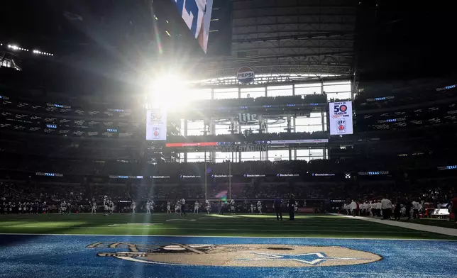 Light streams through a window and onto the field inside AT&amp;T Stadium during the first half of an NFL football game between the Kansas City Chiefs and the Dallas Cowboys Thursday, Nov. 27, 2025, in Arlington, Texas. (AP Photo/Gareth Patterson)