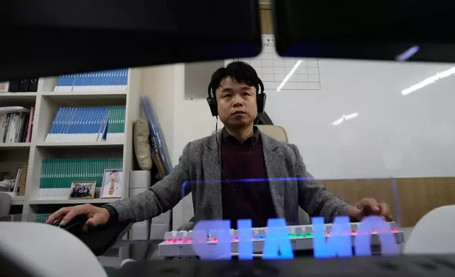 Paek Yosep, a staff of the Korea Internet Studio, works at his office in Seoul, South Korea, Tuesday, Nov. 18, 2025. (AP Photo/Ahn Young-joon)