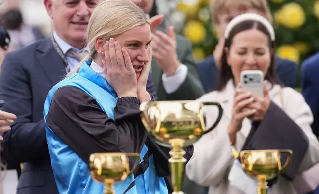 Jockey Jamie Melham reacts after riding Half Yours to win the Melbourne Cup horse race in Melbourne, Australia, Tuesday, Nov. 4, 2025. (AP Photo/Asanka Brendon Ratnayake)