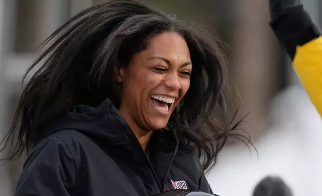 Winner Kaysha Love of the United States celebrates after the women's monobob race at the Bobsleigh World Cup in Innsbruck, Austria, Saturday, Nov. 29, 2025. (AP Photo/Matthias Schrader)