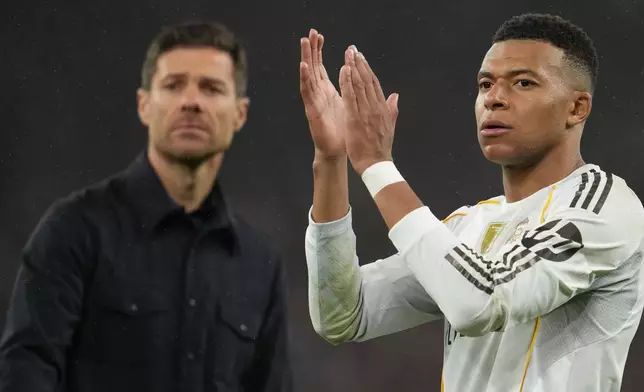 Real Madrid's head coach Xabi Alonso and Kylian Mbappe walk off the oitch after the Champions League soccer match between Liverpool and Real Madrid in Liverpool, England, Tuesday, Nov. 4, 2025. (AP Photo/Jon Super)