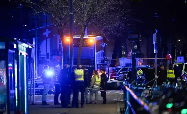 A double-decker bus crashed into a bus shelter in Stockholm on Friday, Nov. 14, 2025, causing fatalities and injuries. (Henrik Montgomery/TT News Agency via AP)