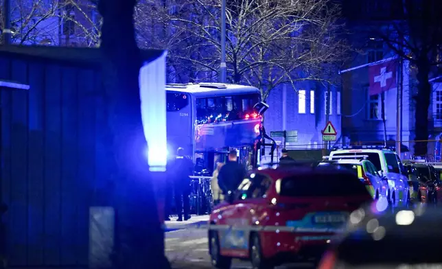 A double-decker bus crashed into a bus shelter in Stockholm on Friday, Nov. 14, 2025, causing fatalities and injuries. (Henrik Montgomery/TT News Agency via AP)